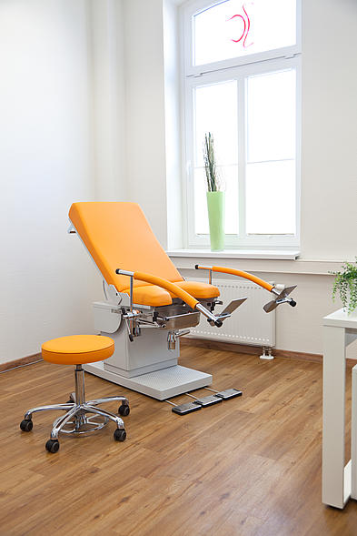 AGA Urological examination chair with mandarin upholstery